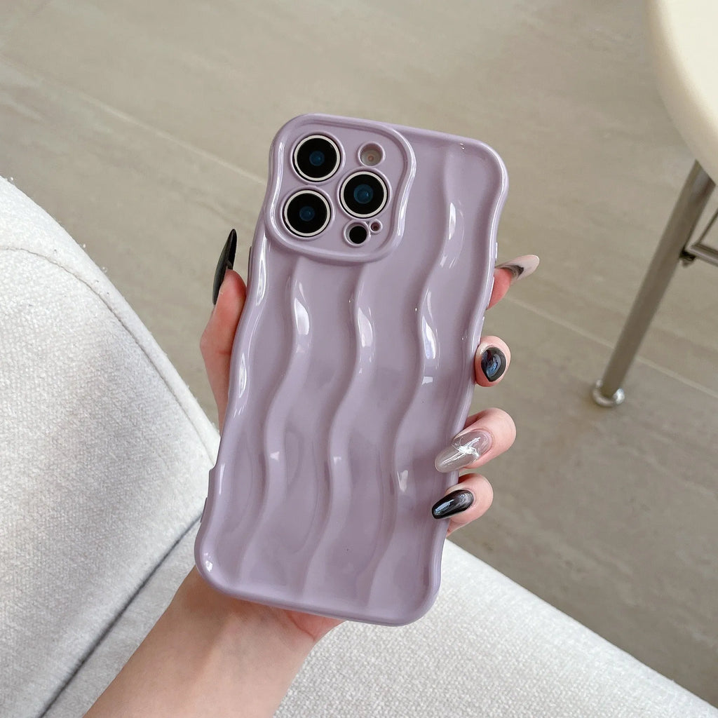 Electroplated wave stripe pattern on a black TPU protective case for iPhone 17 Pro Max.