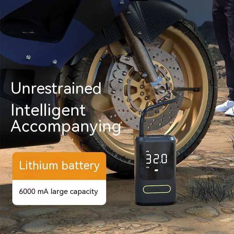 Black handheld digital wireless tyre inflator pump with LED light display on a grey background.
