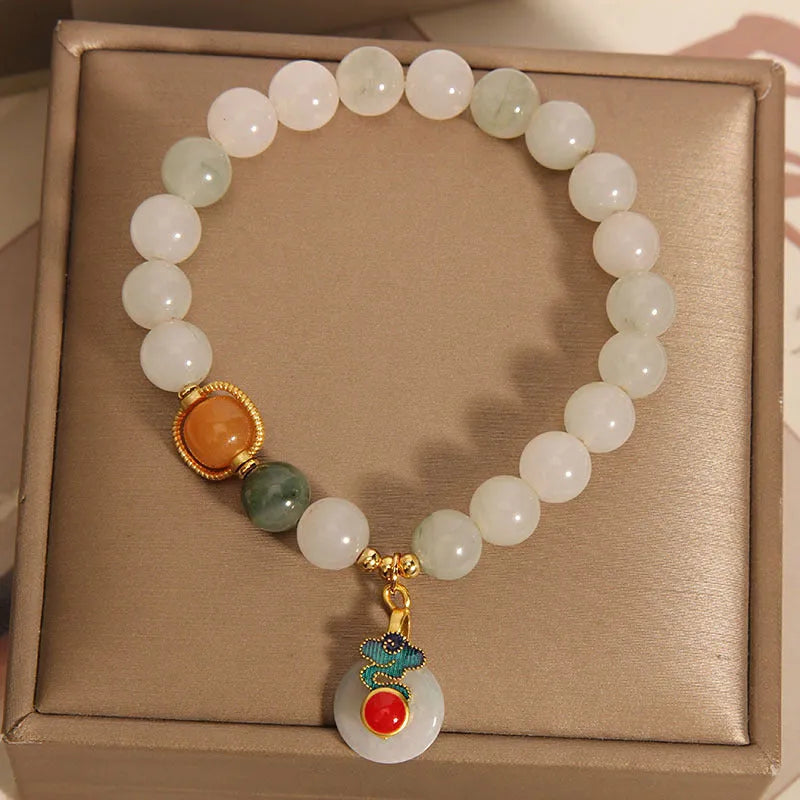 Women's ice jade bracelet with xiangyun peace pattern and pearl accents