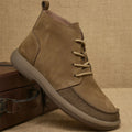 Grey genuine leather mid-calf lace-up boots with a wedge heel on a plain background.