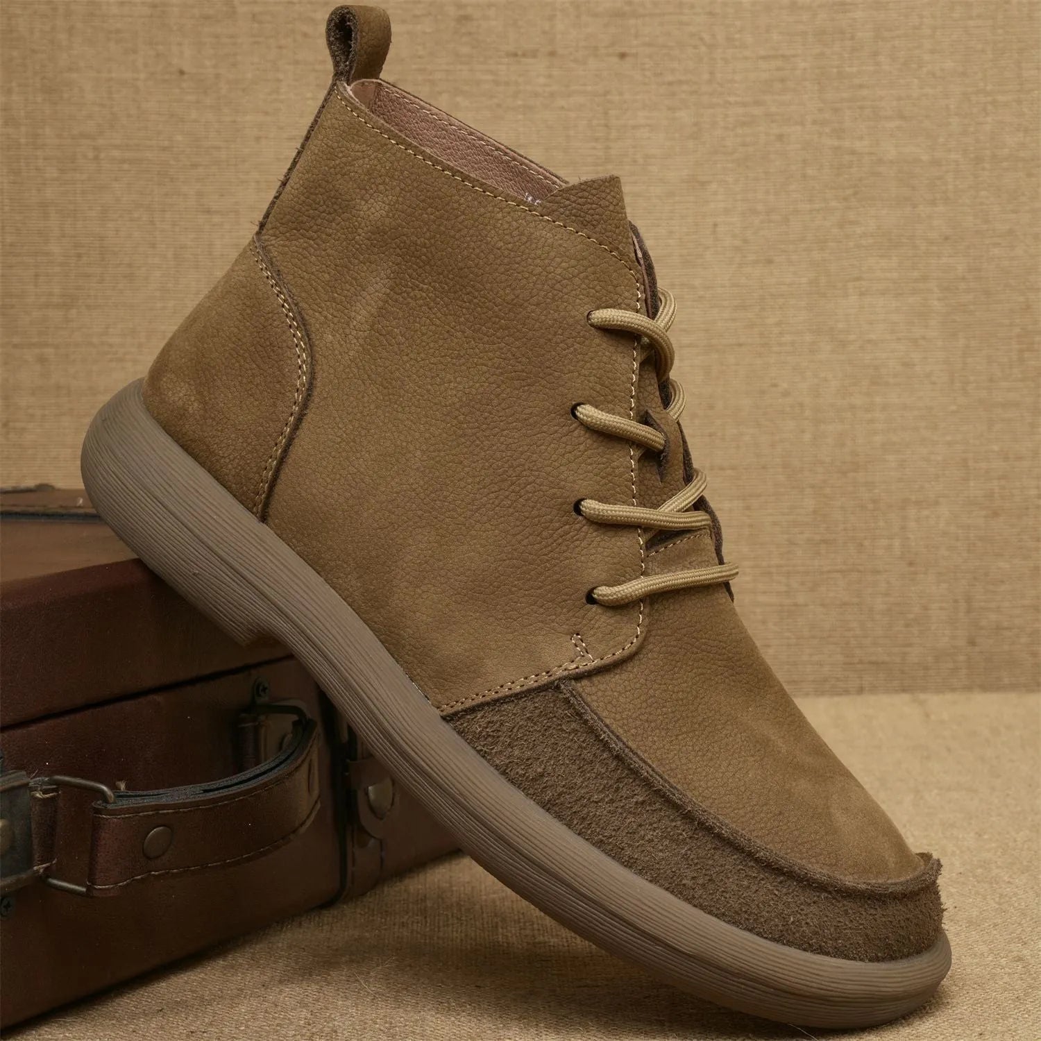 Grey genuine leather mid-calf lace-up boots with a wedge heel on a plain background.