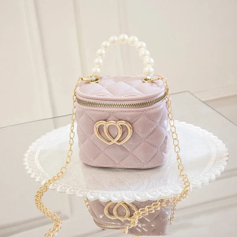 Women's PVC bucket shoulder bag with heart pattern in assorted colours
