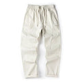 Women's milky white cotton wide-leg trousers with a straight pants-mouth opening, laid flat.