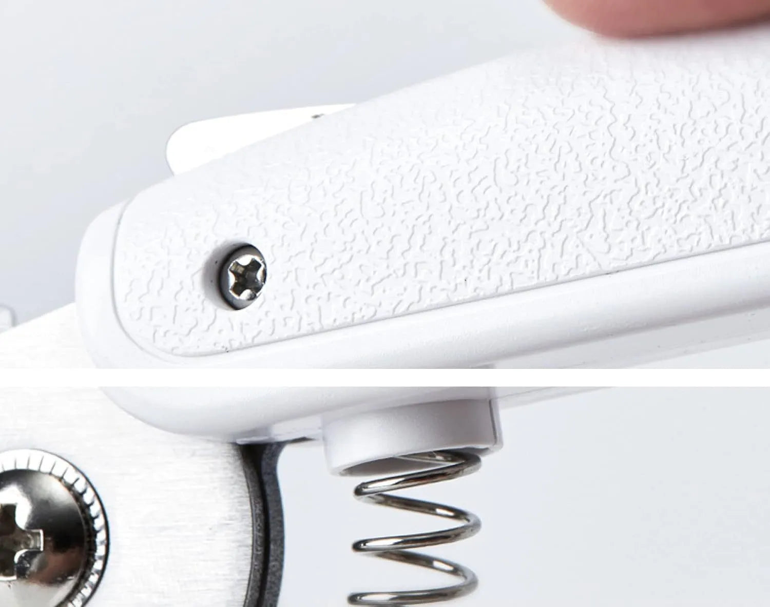 White pet nail clippers with LED light and transparent splash guard open, showing the triangular steel blade.
