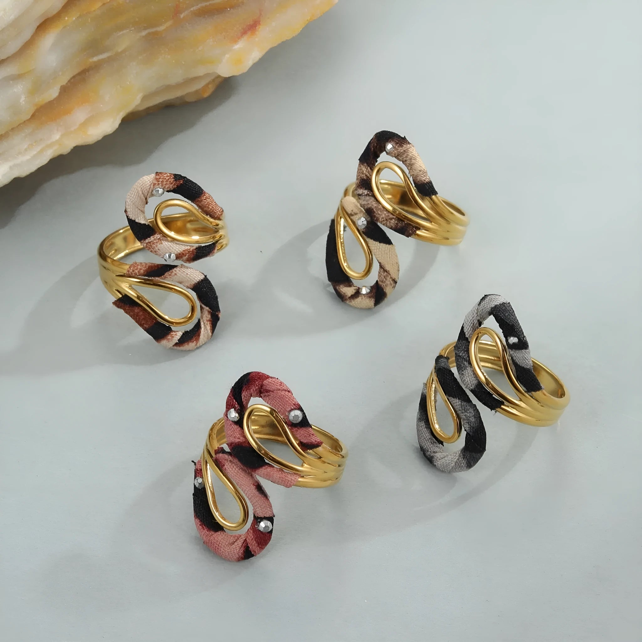 Leopard Series open mouth ring showing geometric asymmetric design with leopard print pattern on stainless steel