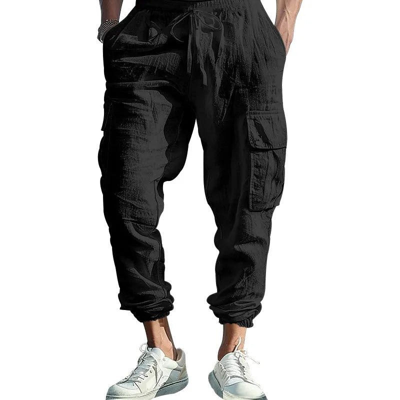 Men's loose linen trousers with ankle tie closure in army green colour.