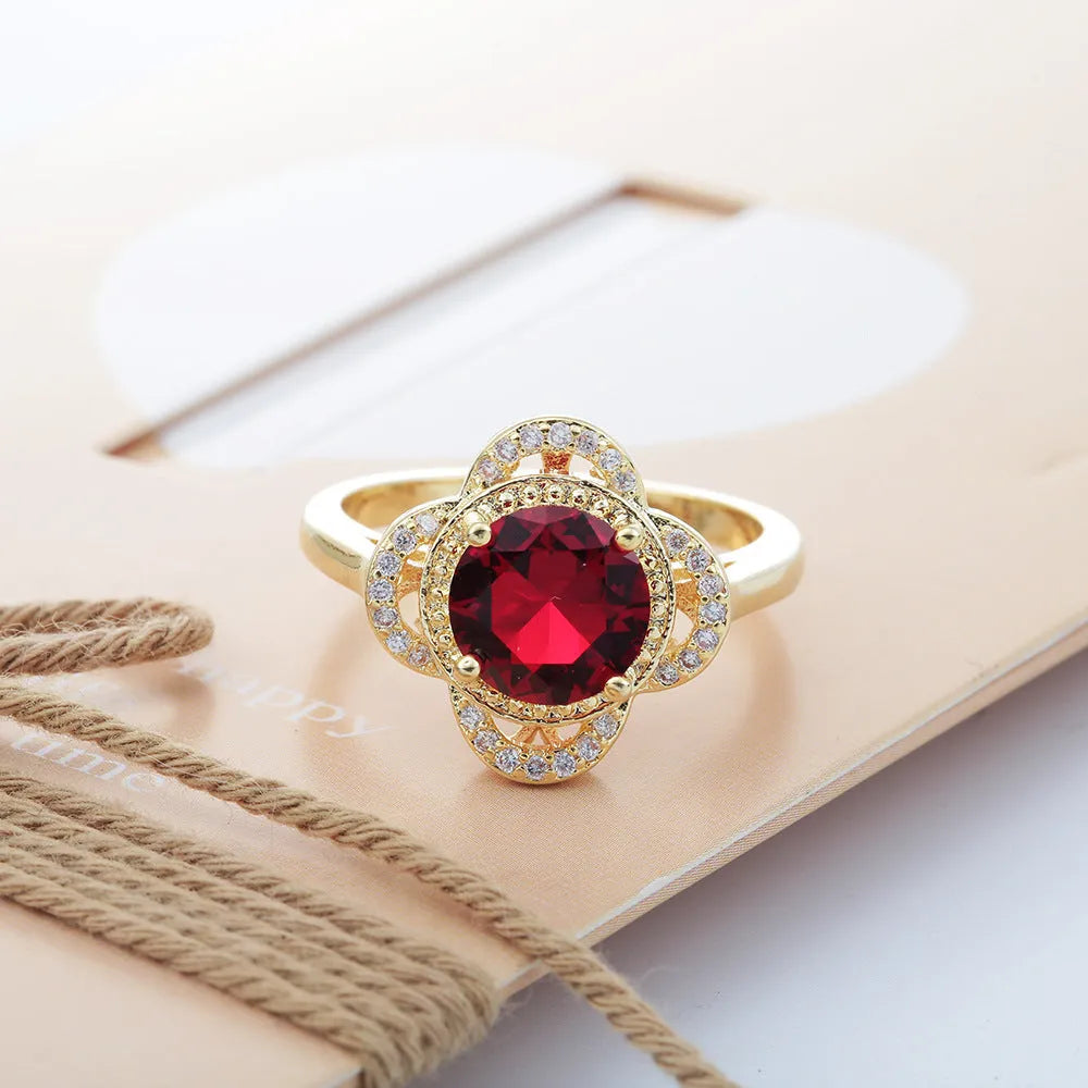 Copper ring with fruit-shaped design and inlaid zircon stone in colour 10-6-1395.