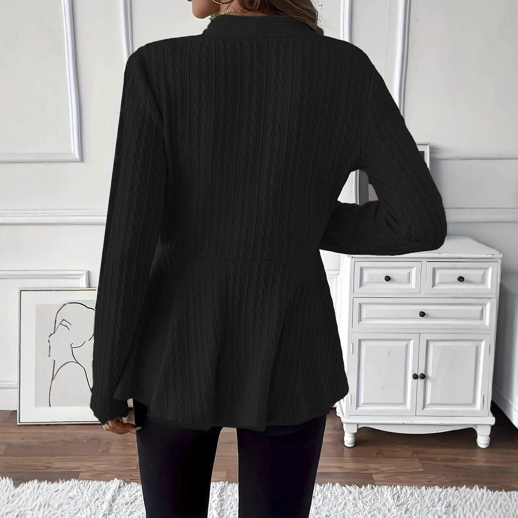 Women's apricot jacquard knit cardigan with one button, shown on a model.