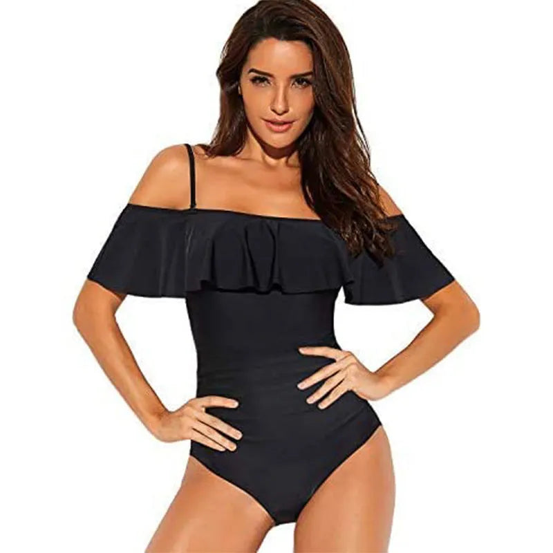Black one-piece swimsuit with cut-out design and ruffled straps on the tube top