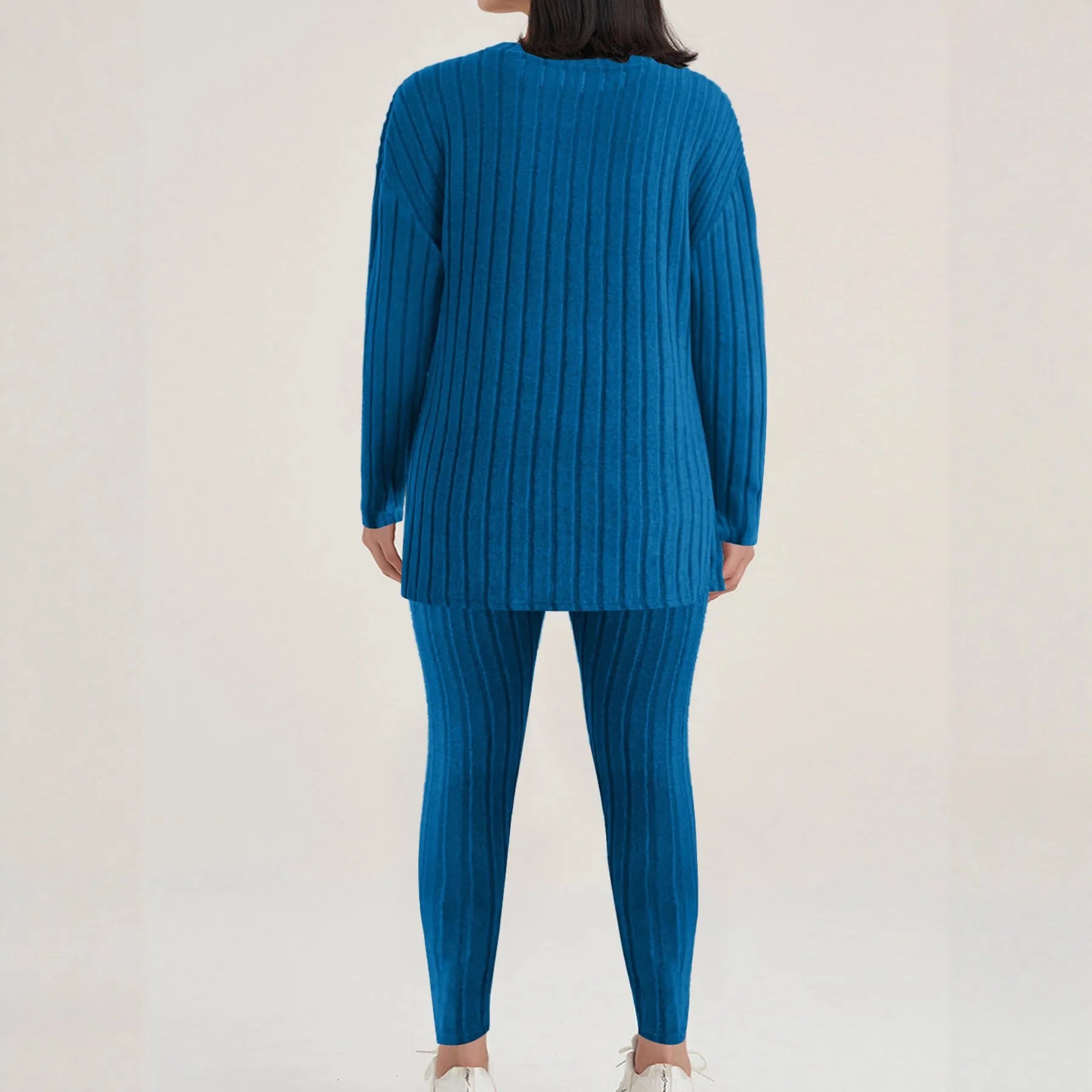 Black sunken stripe polyester two-piece loungewear set with top and pants.
