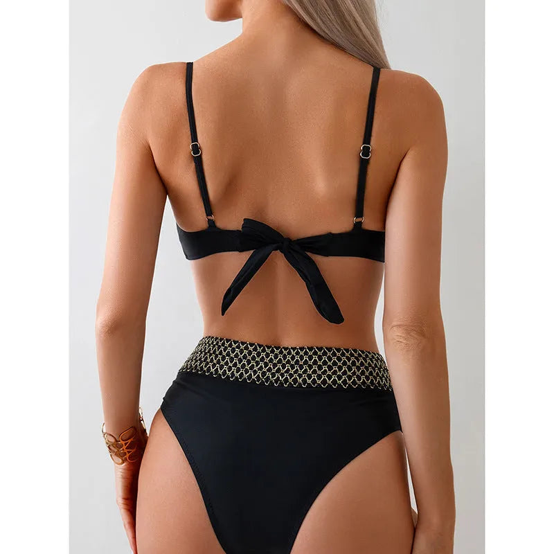 Black women's bikini swimsuit showing sleeveless top and briefs on a mannequin.