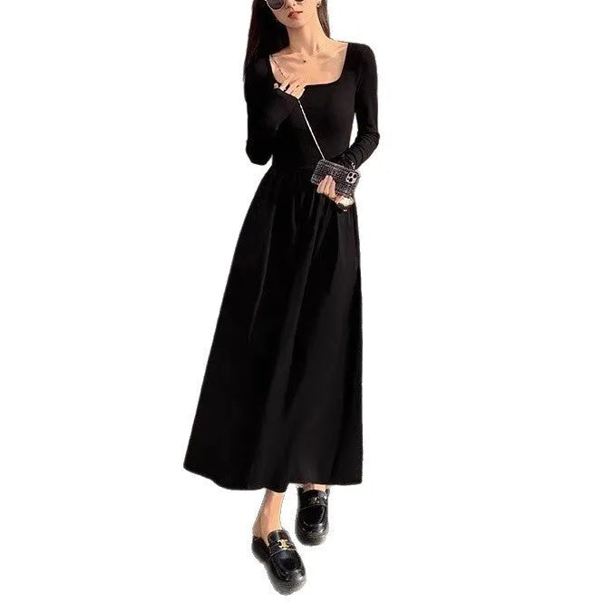 Women's black square collar knitted A-line dress with long sleeves and an elasticated waist.