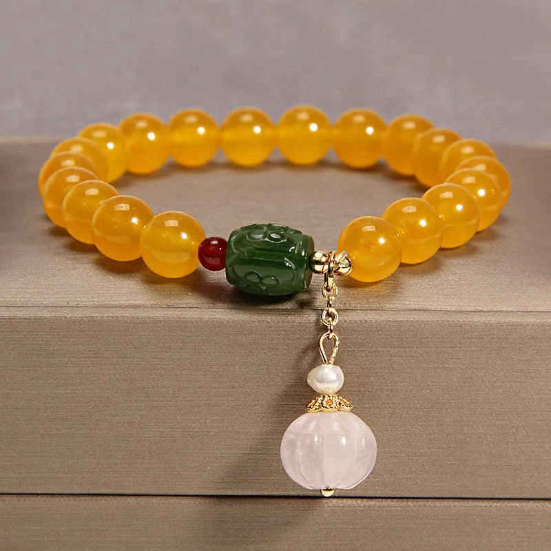 Yellow agate crystal women's bracelet with gold silk thread wrapping in khaki colour