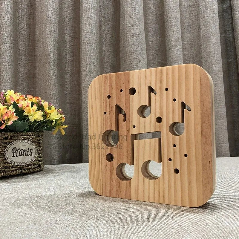 Square pine wood USB LED lamp with warm white light on a desk.