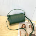 Genuine leather crossbody phone bag in cylindrical shape with single shoulder strap