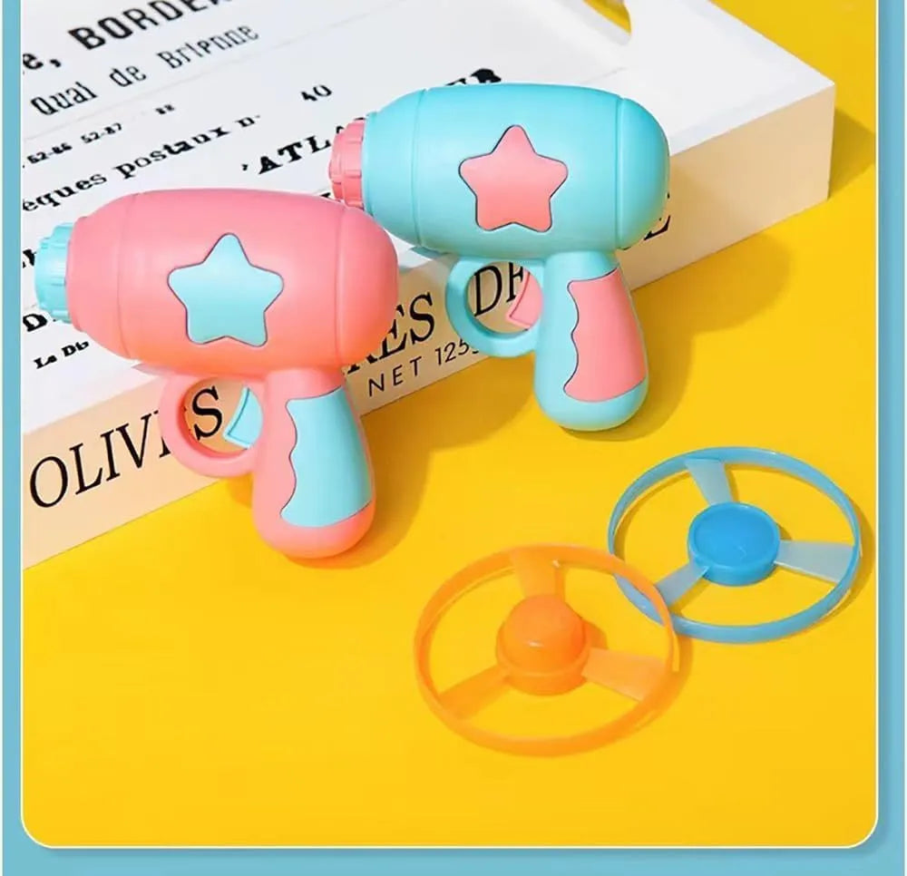 Blue and pink plastic cat toy gun with frisbee measuring 11cm for indoor feline play