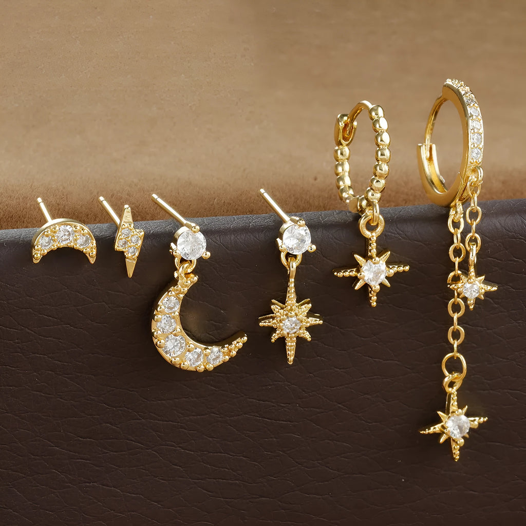 Gold electroplated chain tassel earrings set with six pieces including zircon stud accents