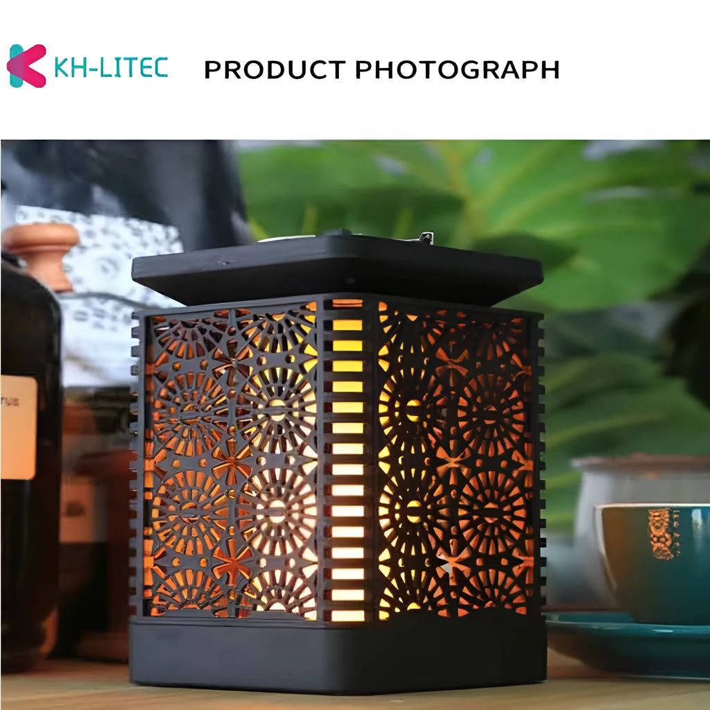 Four black solar-powered flame torch lights with flickering LED effect for garden decoration
