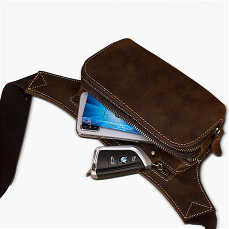 Brown cowhide men's sports waist bag with pull closure showing internal phone compartment