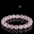 Natural starlight crystal round bead bracelet in pink, shown in a single circle design with polished beads.