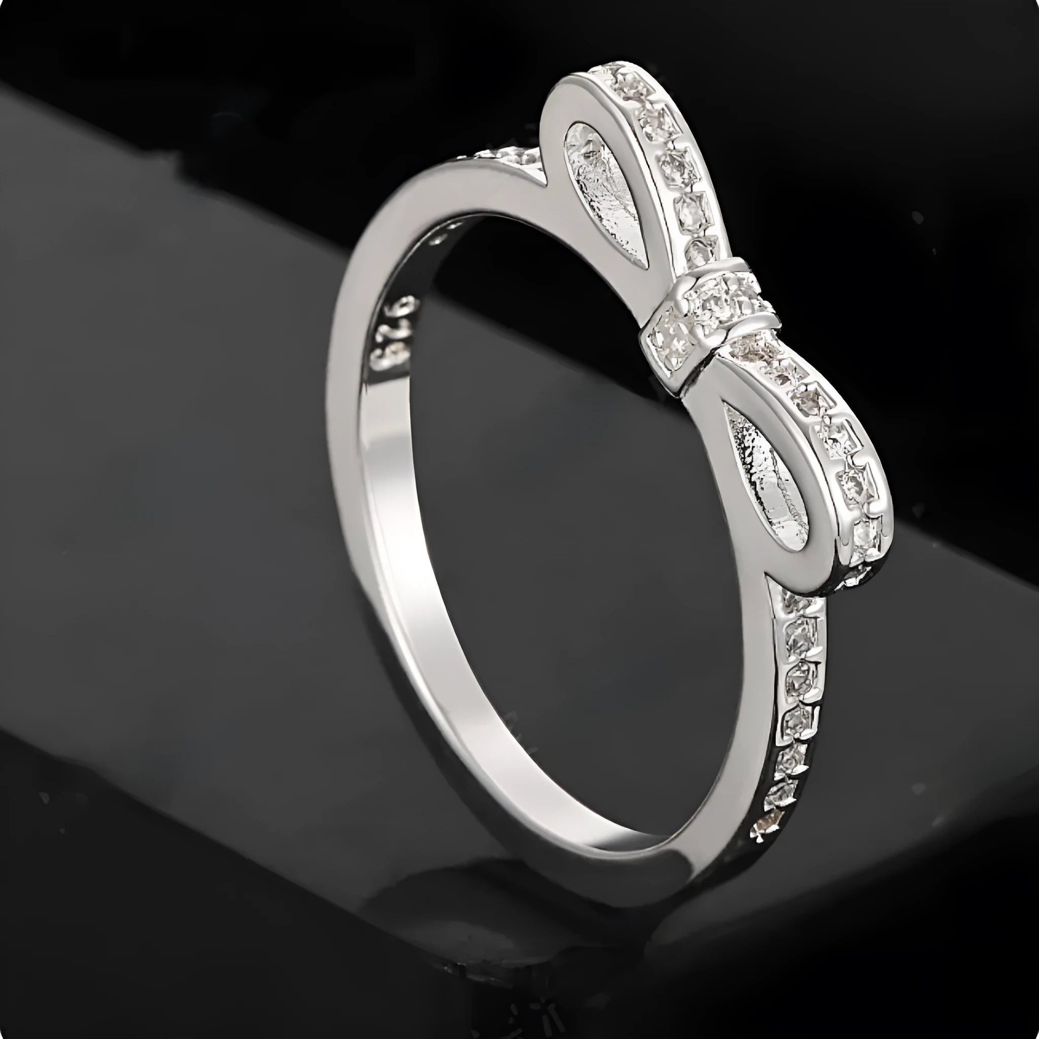 Silver couple's ring with bow design and zircon crystal rhinestones on sterling silver band
