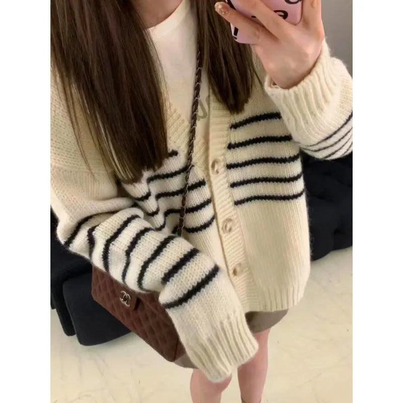 Women's button-down cardigan sweater with a 3D texture pattern in a casual style.