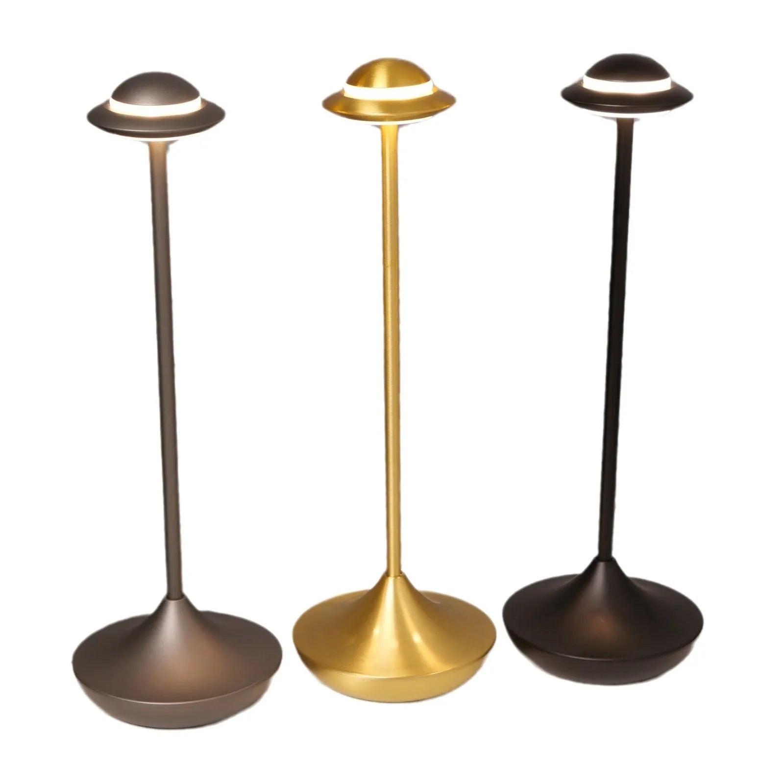 Gold UFO-shaped metal desk lamp with touch controls on creative rechargeable LED lamp