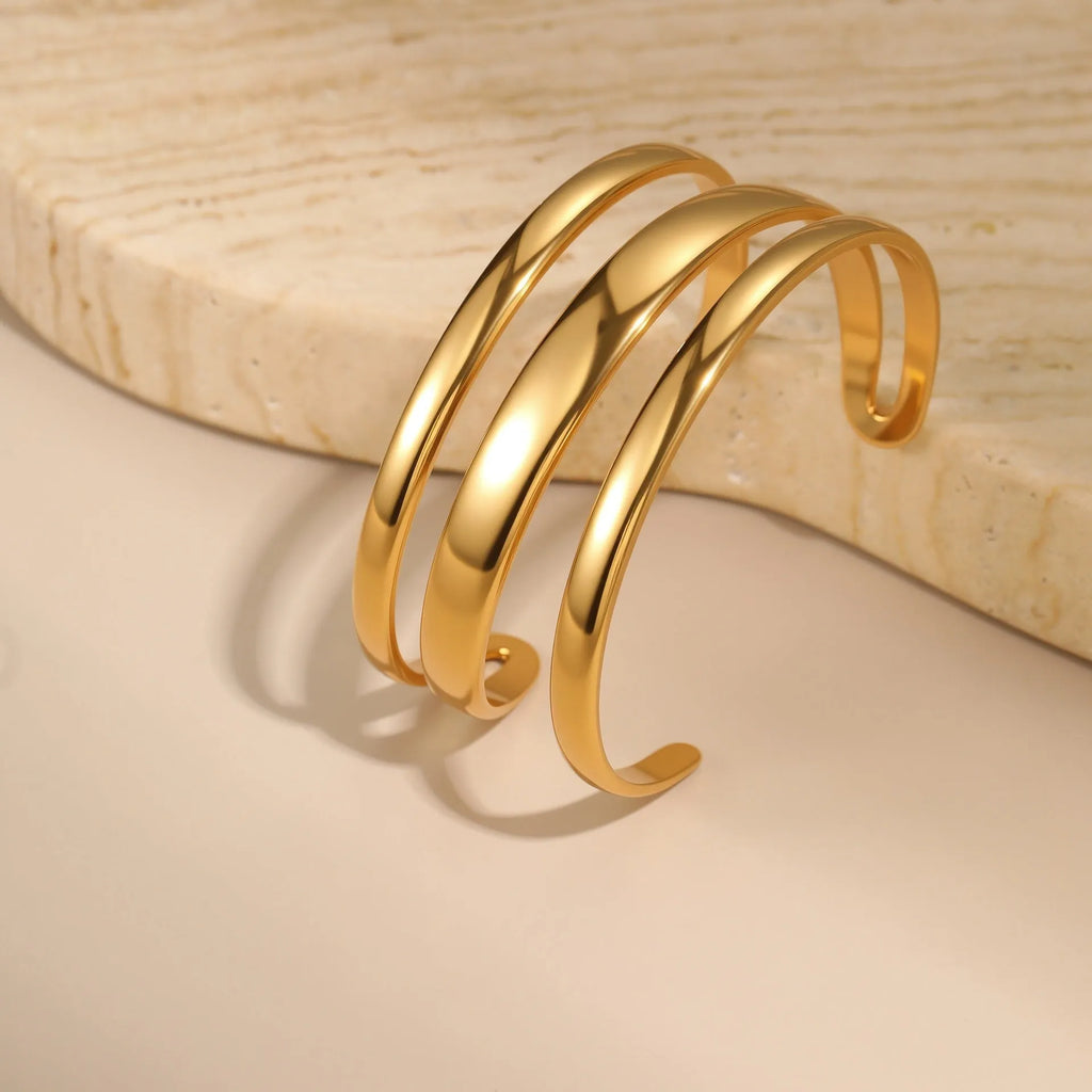 Stainless steel women's bracelet with geometric design and 18K gold electroplating in gold and steel colour options