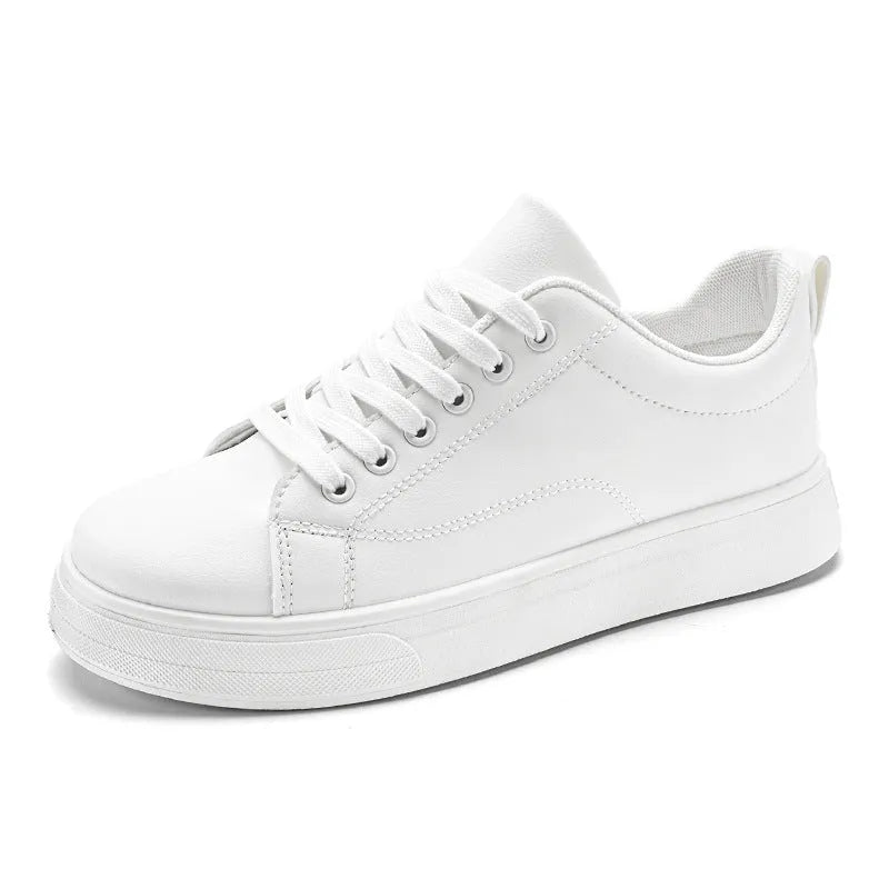 Men's low-top white and black Korean-style casual sneakers with round toe and rubber sole.