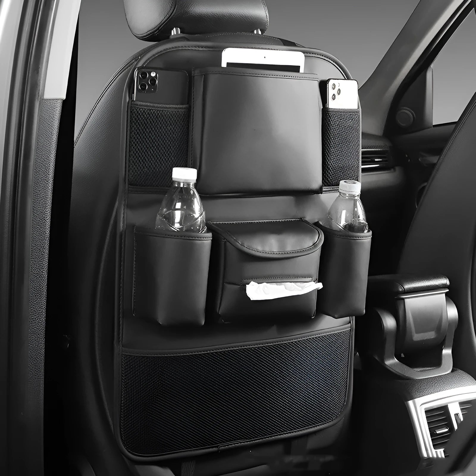 Leather car seat back storage bag hanging from a headrest, shown in brown colour.