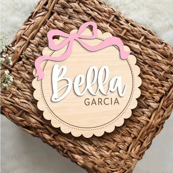Square wooden baby room ornament with custom name text for wall decoration.