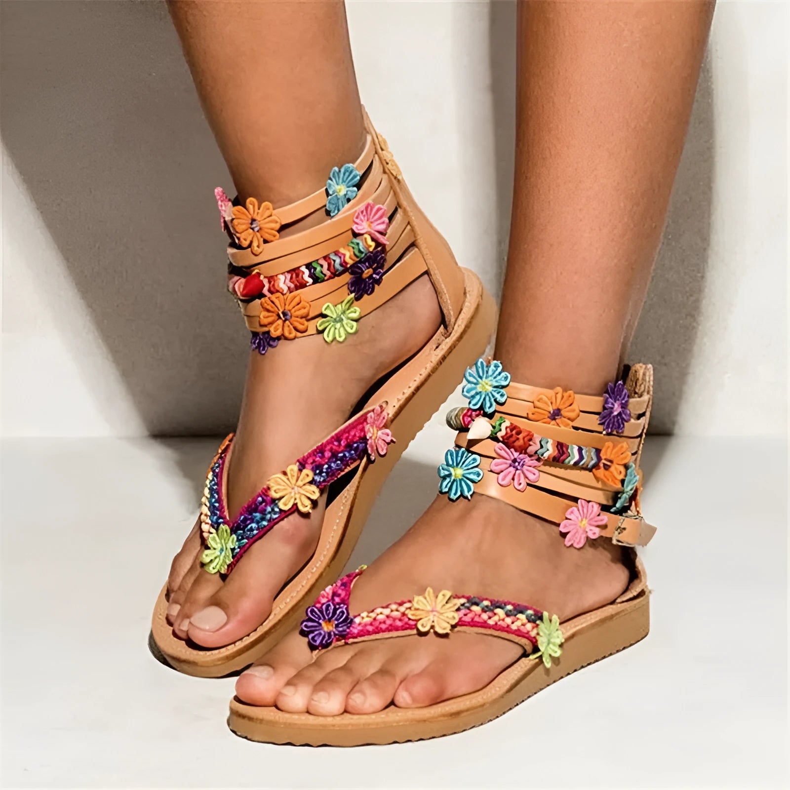 Women's ethnic style beaded petal floral roman sandals with round toe and PU upper.