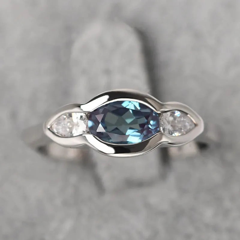 Geometric ellipse zircon ring in white gold finish showing structured design and stone detailing
