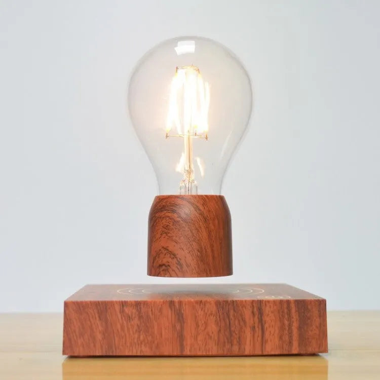 Glass and ABS magnetic levitation bulb floating above an imitation wood base.