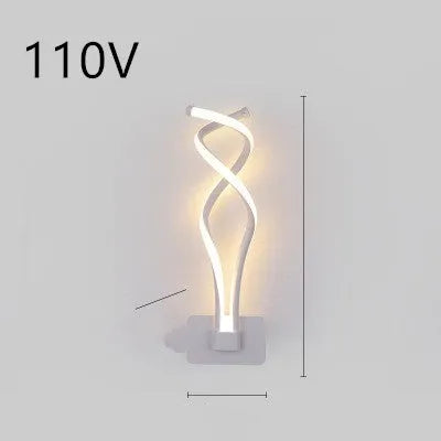 Nordic minimalist LED wall lamp with silicone shade in black finish mounted beside bed