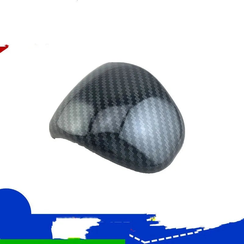 Black carbon fibre pattern gear shift head cover for Smart RunK3 car interior.