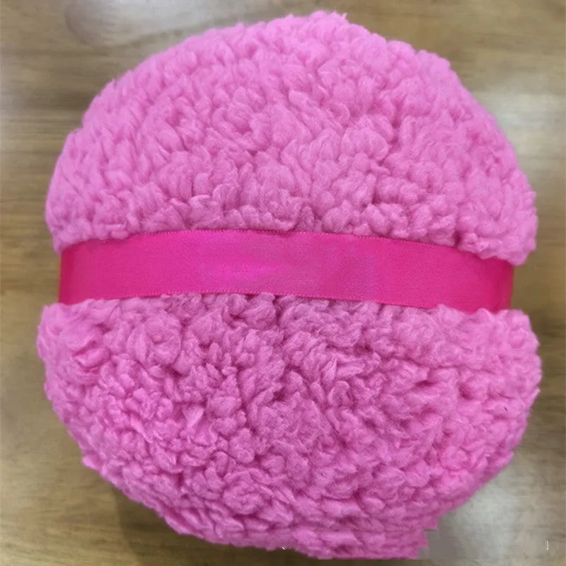 Oversized rectangular plush powder puff for face makeup on a white background.