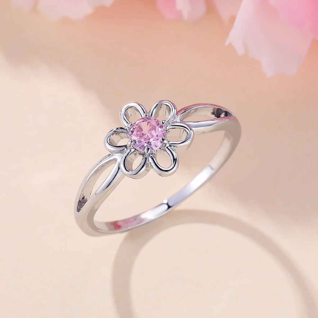 Women's hollow floral fashion ring in copper with electroplated finish, shown in platinum pink diamond colour.