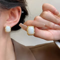 Hand-woven geometric circular metal earrings in colour X0439, Korean style vintage fashion design