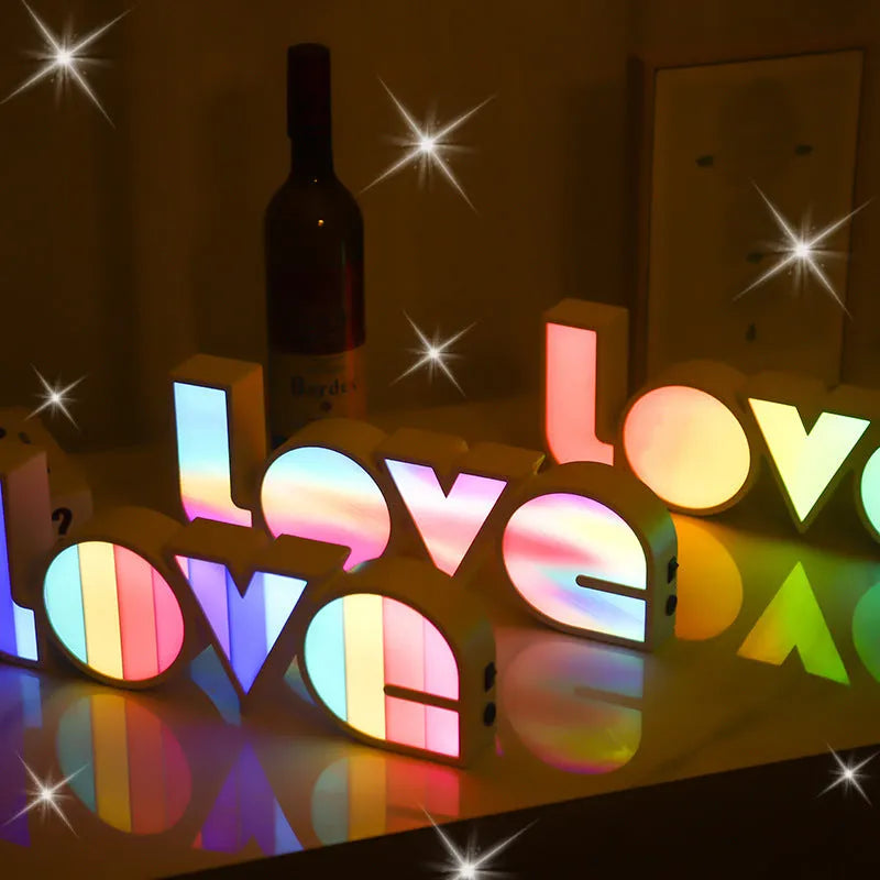 Colourful rainbow LED decorative light spelling LOVE, with USB cable, for Valentine's Day or wedding decor.