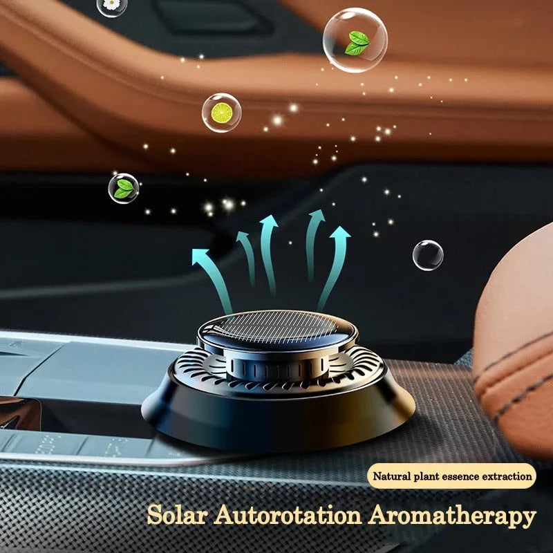 Solar-powered kinetic car air freshener with rotating double ring diffuser in black plastic