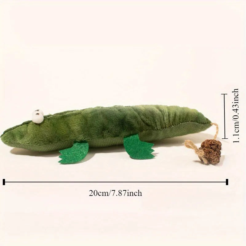Green plush alligator cat toy with a textured reptilian design on a white background.