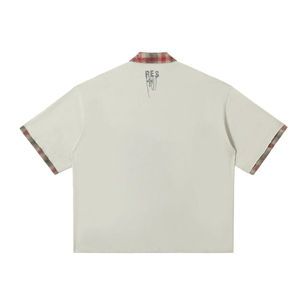 Men's loose fit short-sleeved top with graffiti printing on asymmetric lapel, in cotton fabric.