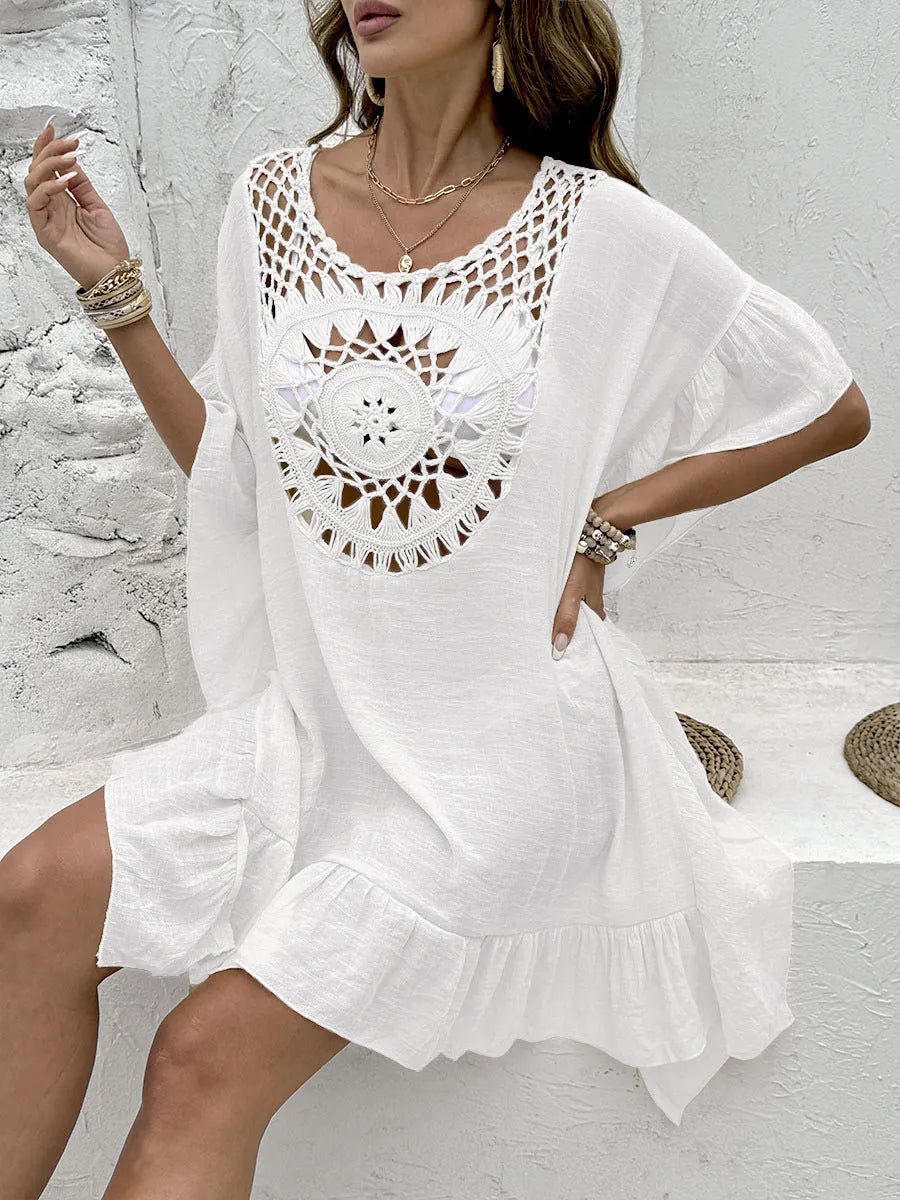 Women's apricot crochet stitch beach dress with patchwork skirt and tassel detail.