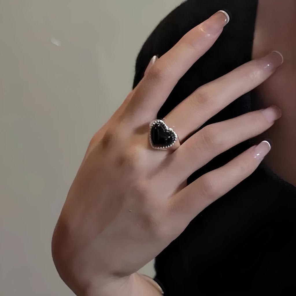 Adjustable sterling silver ring with heart-shaped black agate centrepiece showing open mouth design
