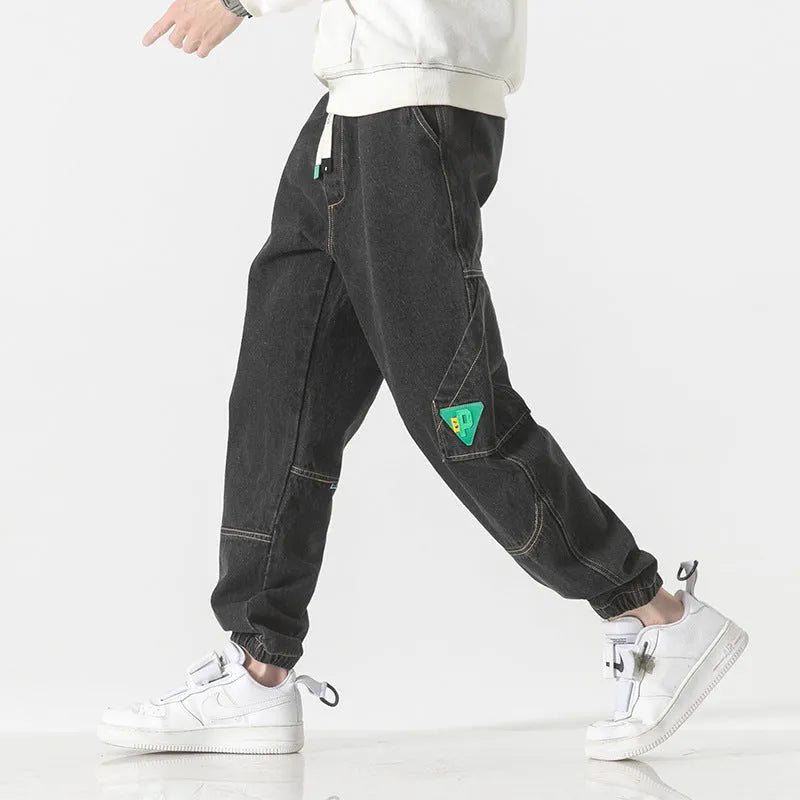 Men's loose-fit tapered cotton trousers in black, blue, or grey with mid waist design
