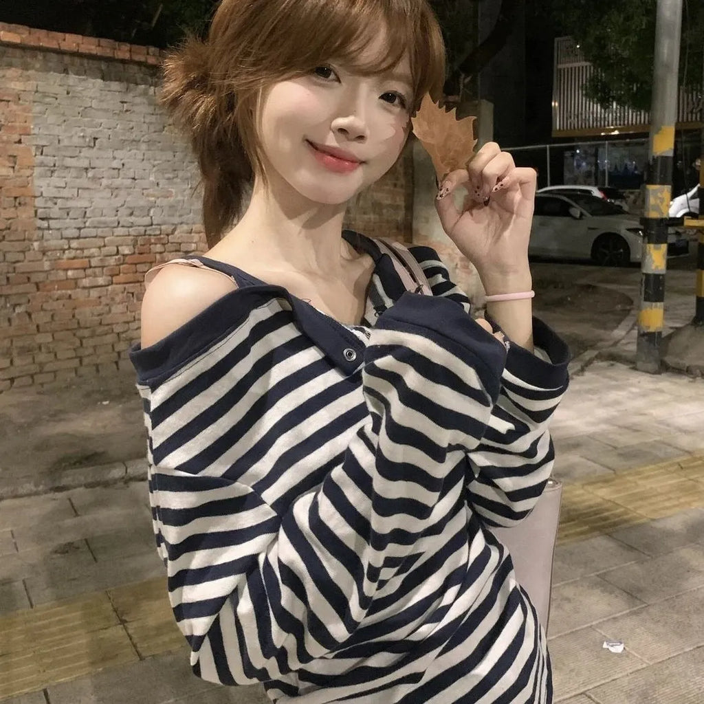 Dark blue oversized women's long-sleeved t-shirt with Korean-style embroidery and button details.