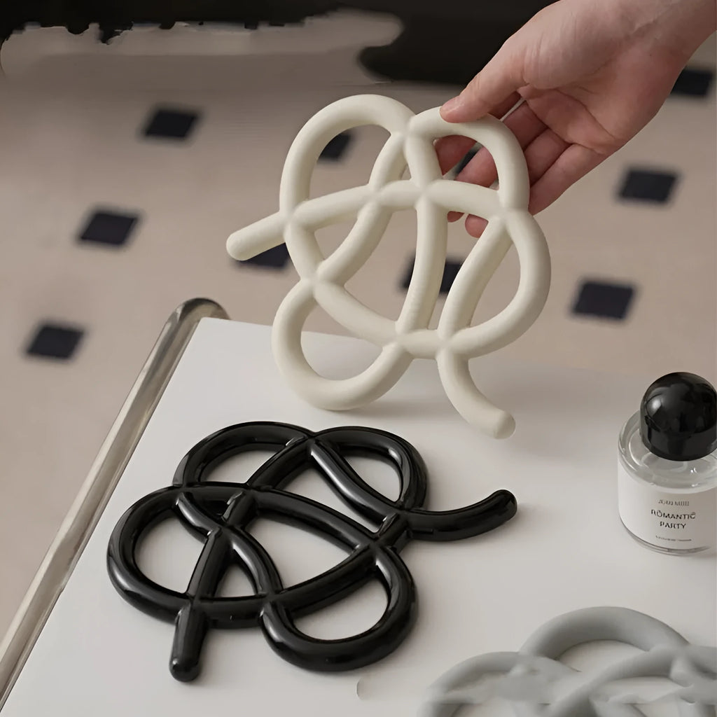 Ceramic heat proof mat in irregular shape for table protection in solid colours