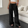 Women's black wide leg trousers with lace-up waist trimming detail showing mid-waist design