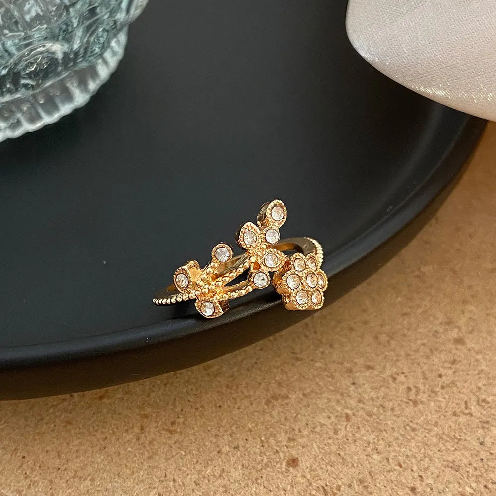 Women's open ring with diamond flower leaves design in copper, gold or white colour options